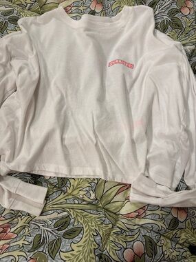 Hollister White Cropped Long Sleeve Tee with Pink Logo Arch